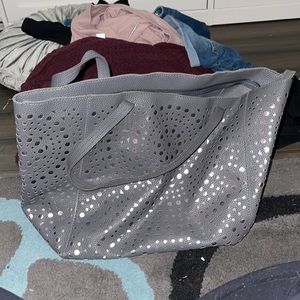 Grey bag with metallic pink cutouts
